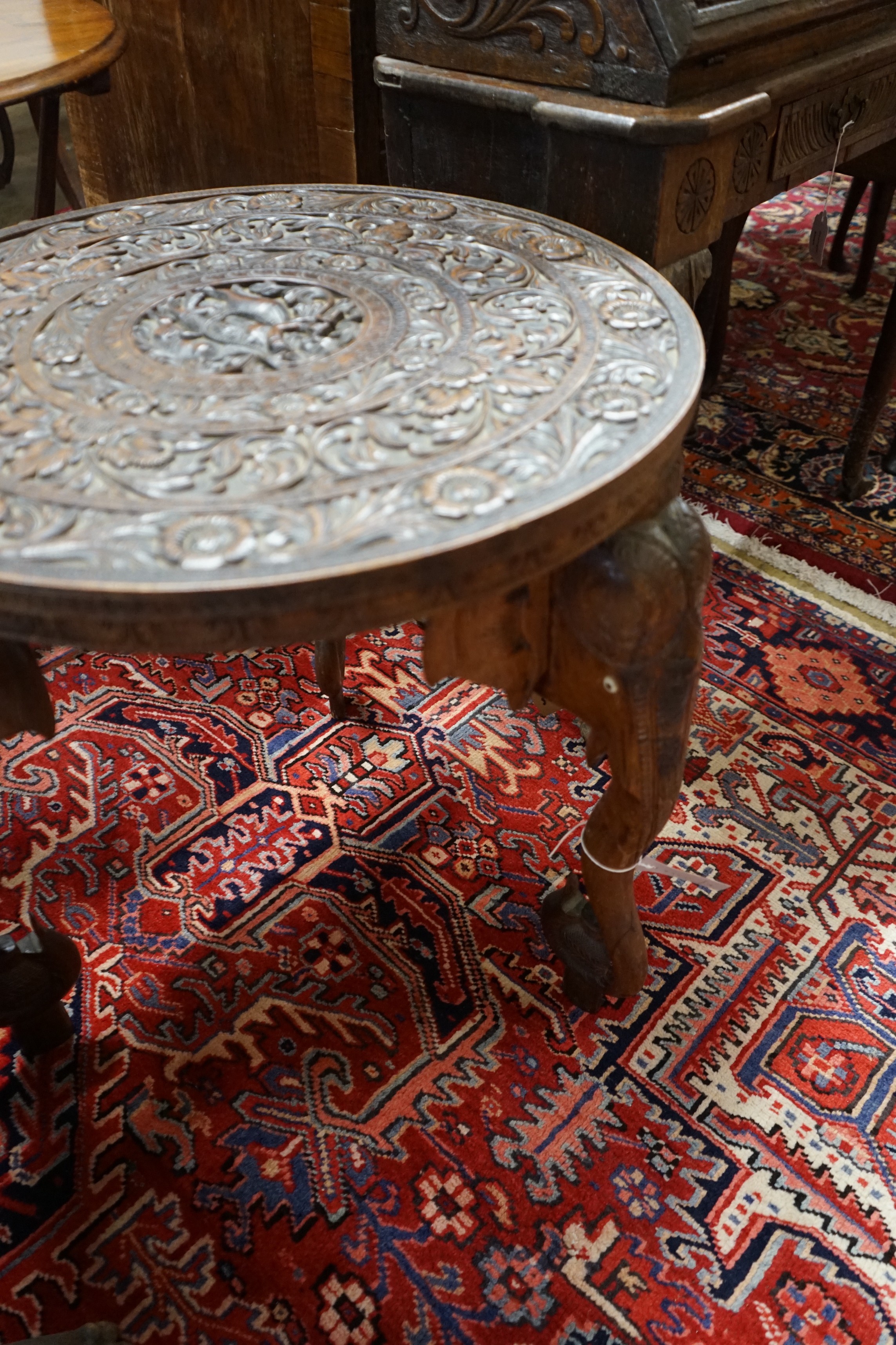 An Indian circular carved hardwood occasional table, diameter 60cm, height 63cm